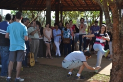 Participants play Brazilian capoeira during the barbecue